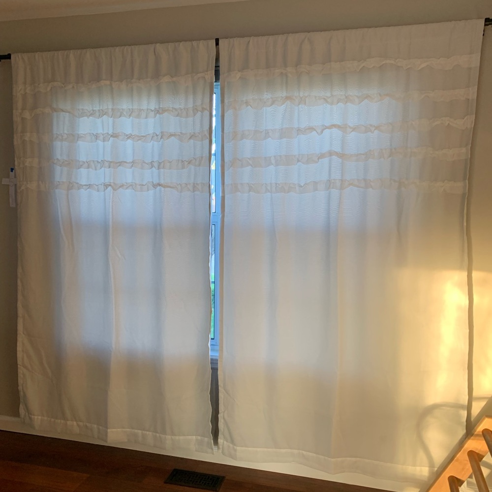 3 panels of white ruffle black out curtains. Accepting offers